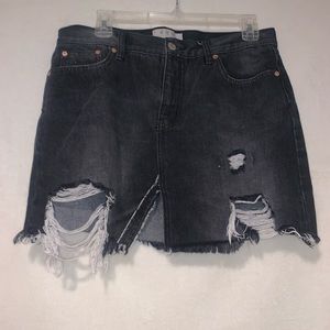 Black denim Free People skirt with slit.
